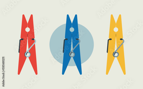 Three colorful clothespins red blue and yellow arranged in a row