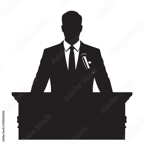 Silhouette of a man in a suit and tie standing at a podium with a microphone pinned to his lapel