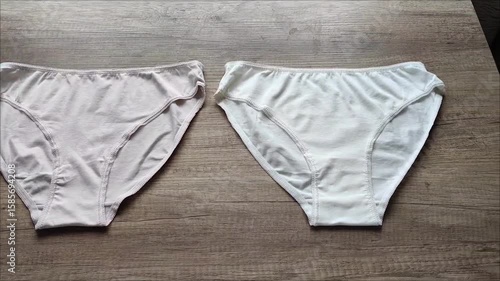 Classic women's underwear, cotton slip panties on a wooden background