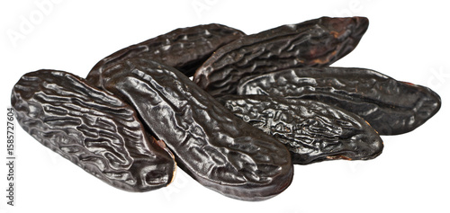 Black Tonka beans isolated on white background.