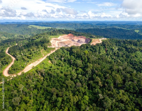 Aerial view of a quarry in a lush forest