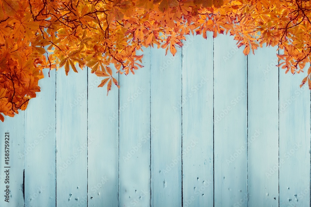 Fototapeta premium Flat design showing weathered blue wooden planks being topped by vibrant autumn leaves border