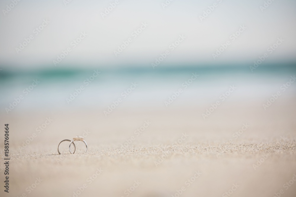 Fototapeta premium Close-up of wedding rings at beach