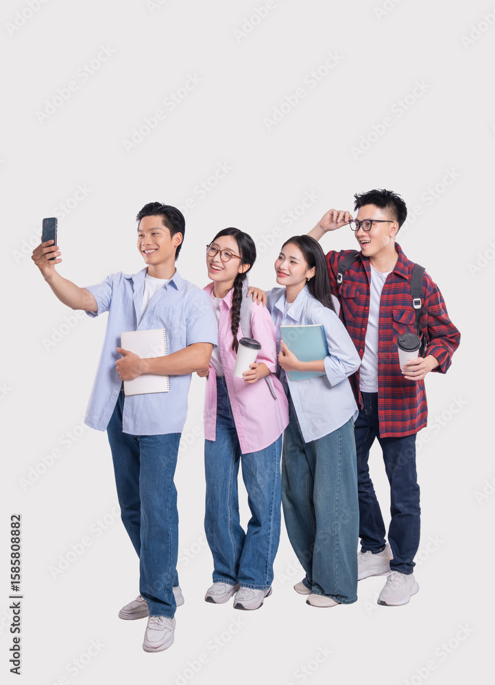 Obraz premium Group selfie of diverse stylish students holding books and coffee against a solid background