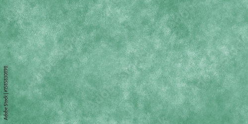 Abstract Elegant dark green background with mottled vintage texture in old fancy background design, texture of colored parchment paper.