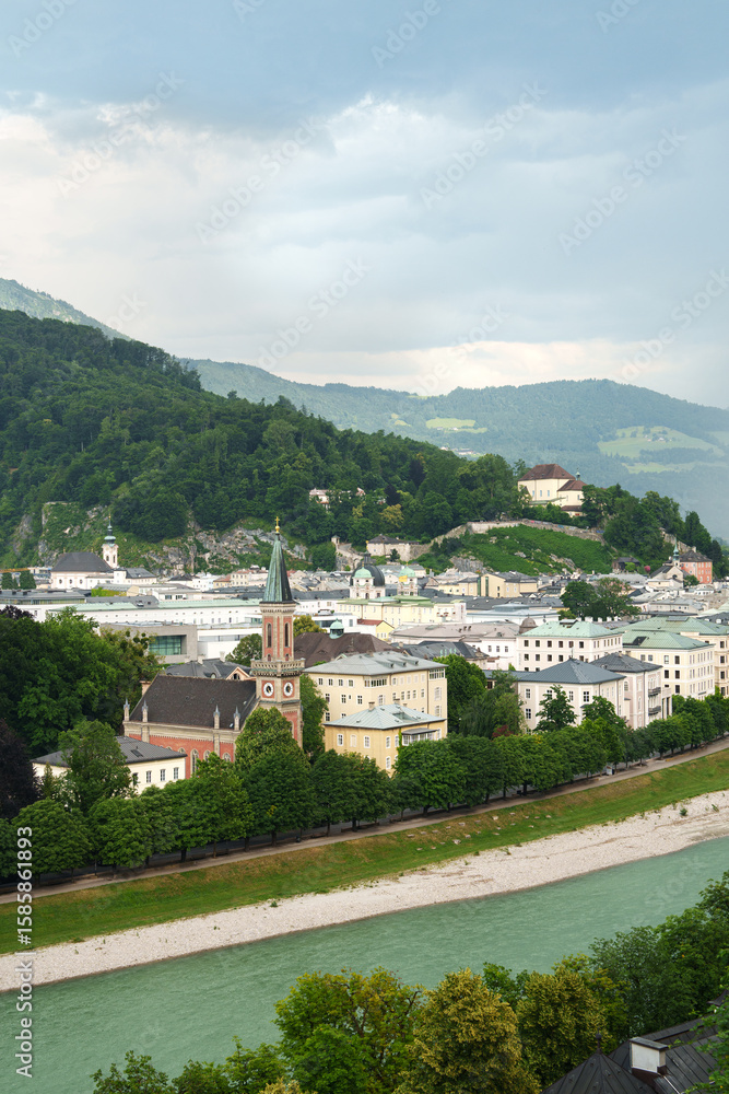 Obraz premium Panorama of Salzburg, a city between mountains and river.