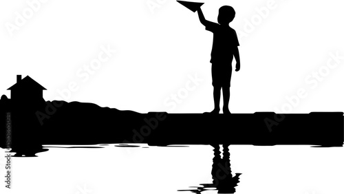 Silhouette of a boy launching a paper airplane on a dock with a house in the background near water edge