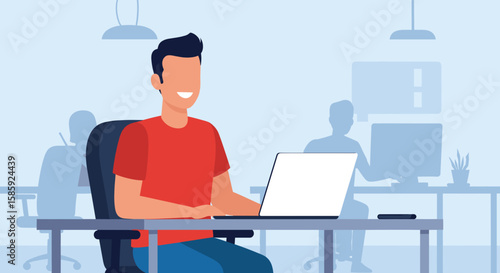 A smiling young man in a red shirt is productively working on his laptop at a desk within a contemporary office environment.