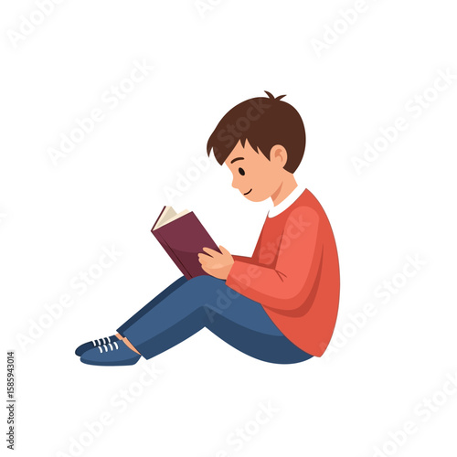 A young boy sits cross-legged, engrossed in reading a book with a focused and happy expression.