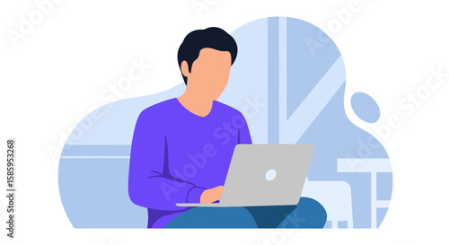 A young man sitting cross-legged and working on a laptop computer in a modern, minimalist interior space.