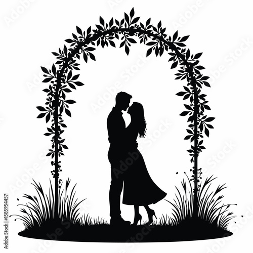Couple embracing under floral arch silhouette