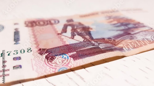 500 ruble bills on the table. Ruble banknotes, paper money, finance.