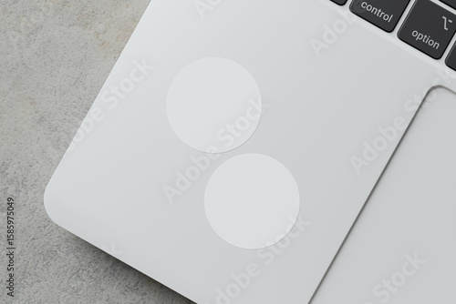 glued sticker for mockup. round stickers set collection. realistic paper on laptop background. blank space for creative design.3d high resolution rendering.