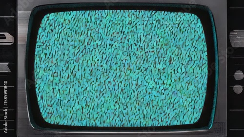 A vintage television set displaying static with a blue hue. The screen shows horizontal lines and noise, evoking a retro technology feel.