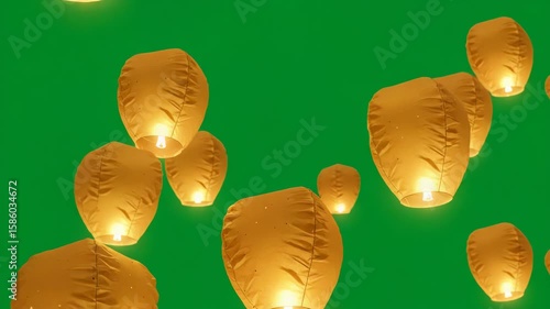 Sky Lanterns Afloat: A mesmerizing shot capturing multiple glowing sky lanterns gracefully ascending against a vibrant emerald background, symbolizing hope, dreams and a sense of wonder.