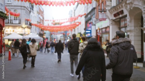 Photography Blurred people strolling on chinatown street in london under red lanterns displaying winter fashion, capturing urban ambiance with bokeh effects in an autumn setting