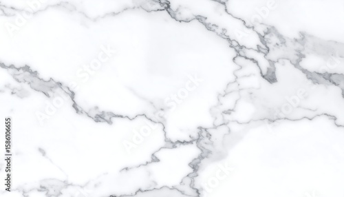 Close-up view of a white marble surface with subtle gray veins