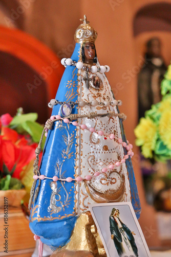 Statue of Our Lady of Lujan adorned with beaded necklaces in the Church of the Rosary in Andacollo, Catamarca, Argentina.