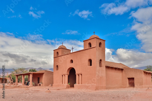 Colonial adobe building with bell towers and arches at the Rosary Church. Located in Andacollo, Catamarca, Argentina, on the famous Adobe Route.