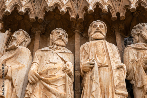 Tarragona Cathedral, Tarragona, Catalonia, Spain. Features unique medieval sculptures of apostles and prophets on its grand entrance, including rare female biblical figures—unusual in Gothic portals.