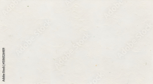 Subtle textured off white paper with delicate creases and scattered small colorful flecks