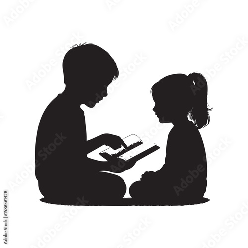 Brother reading a book to his younger sister in silhouette