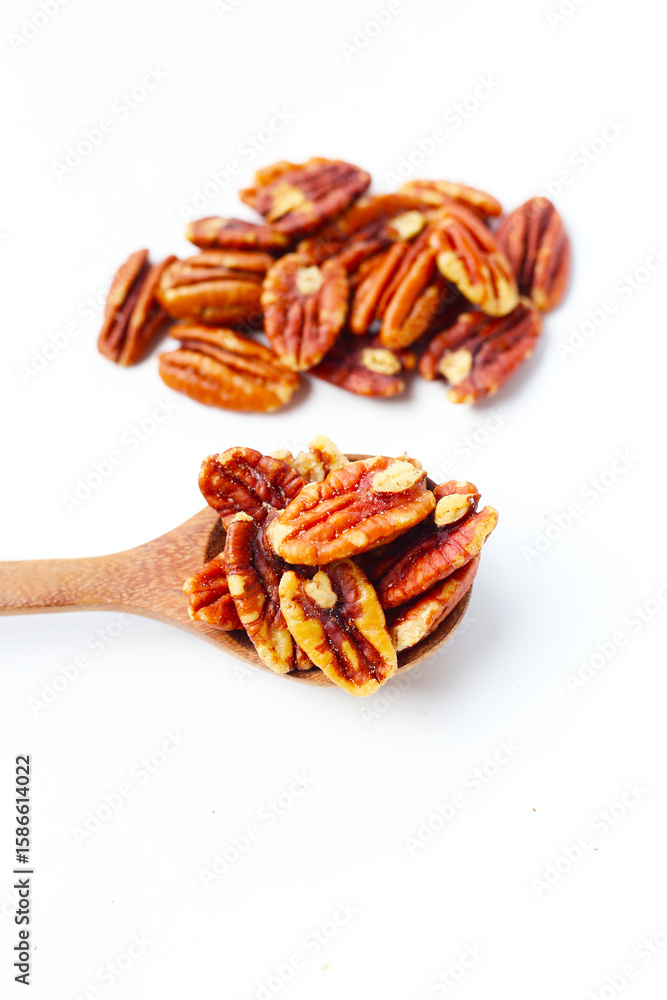 Fototapeta premium Delicious salted pecan nuts scattered.