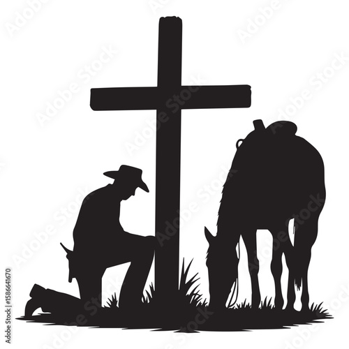Silhouette of a cowboy kneeling in prayer beside a cross with his horse grazing peacefully nearby
