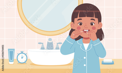 A young girl in pajamas flossing her teeth in a bathroom with a sink, mirror, and toiletries.
