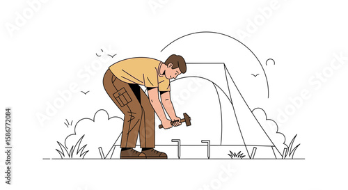Man Assembling A Camping Tent With Hammer For Outdoor Recreational Activity