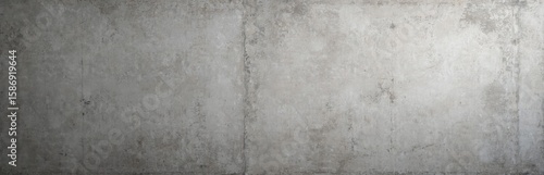 Weathered concrete wall texture in grey tones offers grunge, brut industrial style. Raw, aged cement surface provides modern, urban interior design backdrop wallpaper. Seamless, textured look suits