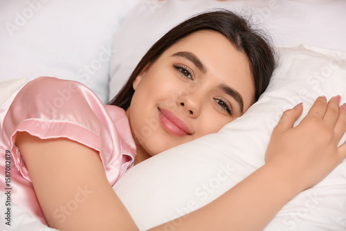 Young woman lying on soft p...