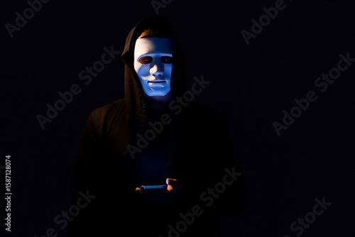Hacker with mobile phone on...