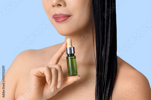 Beautiful woman with bottle...
