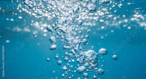 Rising Bubbles in Clear Blue Underwater Scene