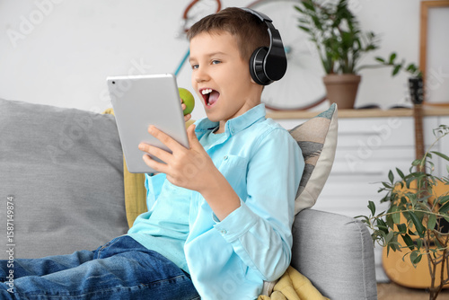 Teenage boy in headphones e...