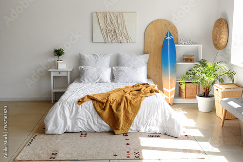 Surfboard and large bed in ...
