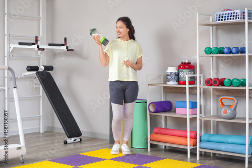 Sporty young happy Asian wo...