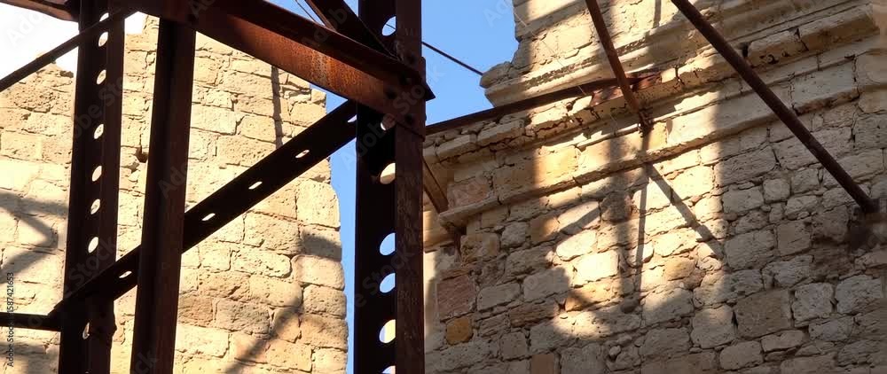 custom made wallpaper toronto digitalRusty Metal Frame and Stone Wall Ruins Against Blue Sky