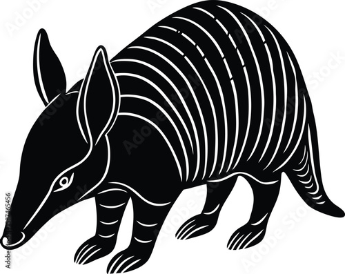 Black armadillo with segmented shell and pointed snout white animal