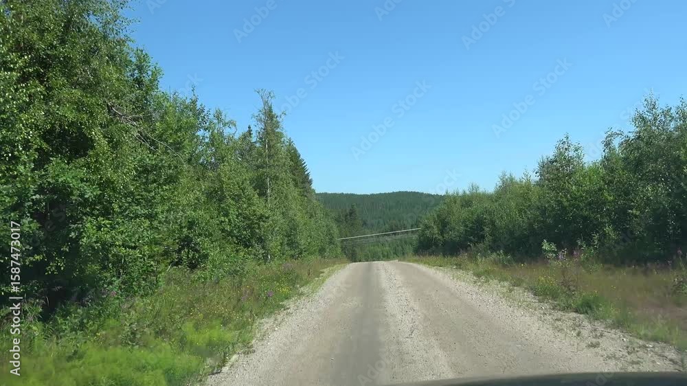 Are, Sweden A car drives on a rural dirt road. Are, Sweden A car drives on a rural dirt road.