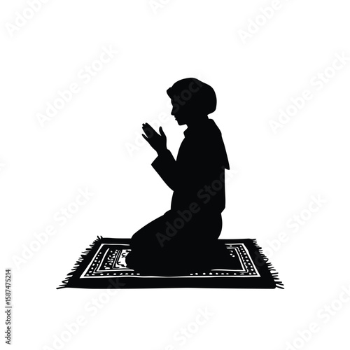 Person kneeling on prayer rug praying silhouette