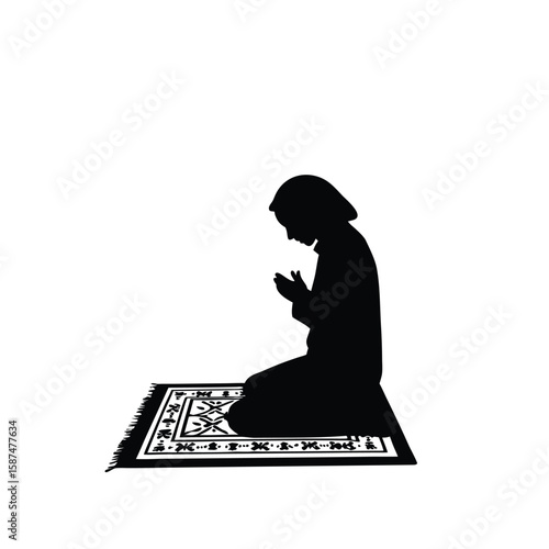Person praying on patterned rug silhouette kneeling