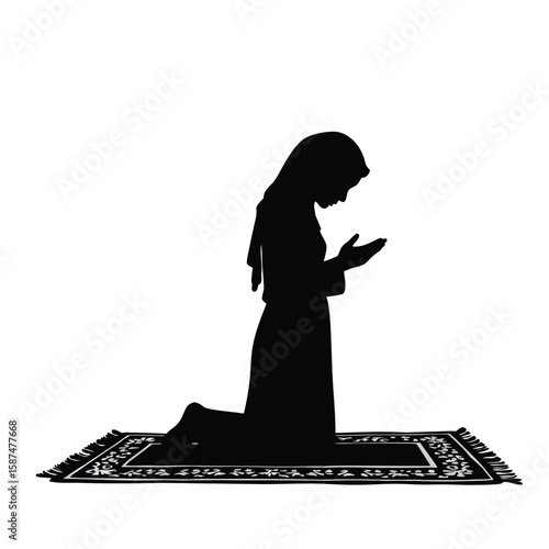 Woman praying on rug kneeling prayer mat