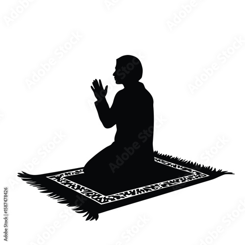 Person praying on patterned rug silhouette kneeling