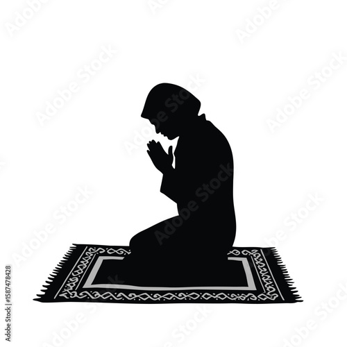 Person praying on patterned rug silhouette kneeling