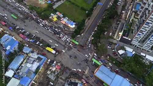 Aerial View of Crowded Suburban Intersection with Vehicles