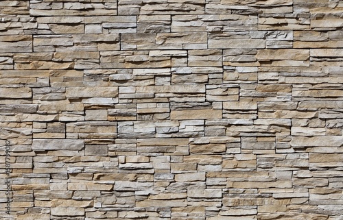 Wallpaper Mural External wall coating made of striped stacked  brown, gray and white rocks. Background and texture. Torontodigital.ca