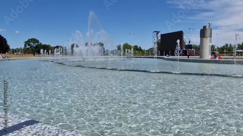 Crystal Clear Modern Fountain in City Park on Sunny Summer Day