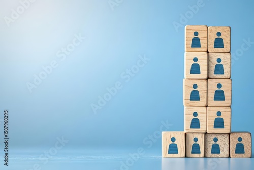 Building a strong team, Wooden blocks with people icon on blue background, Human resources and management concept